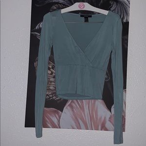 Cropped and tight long sleeved top